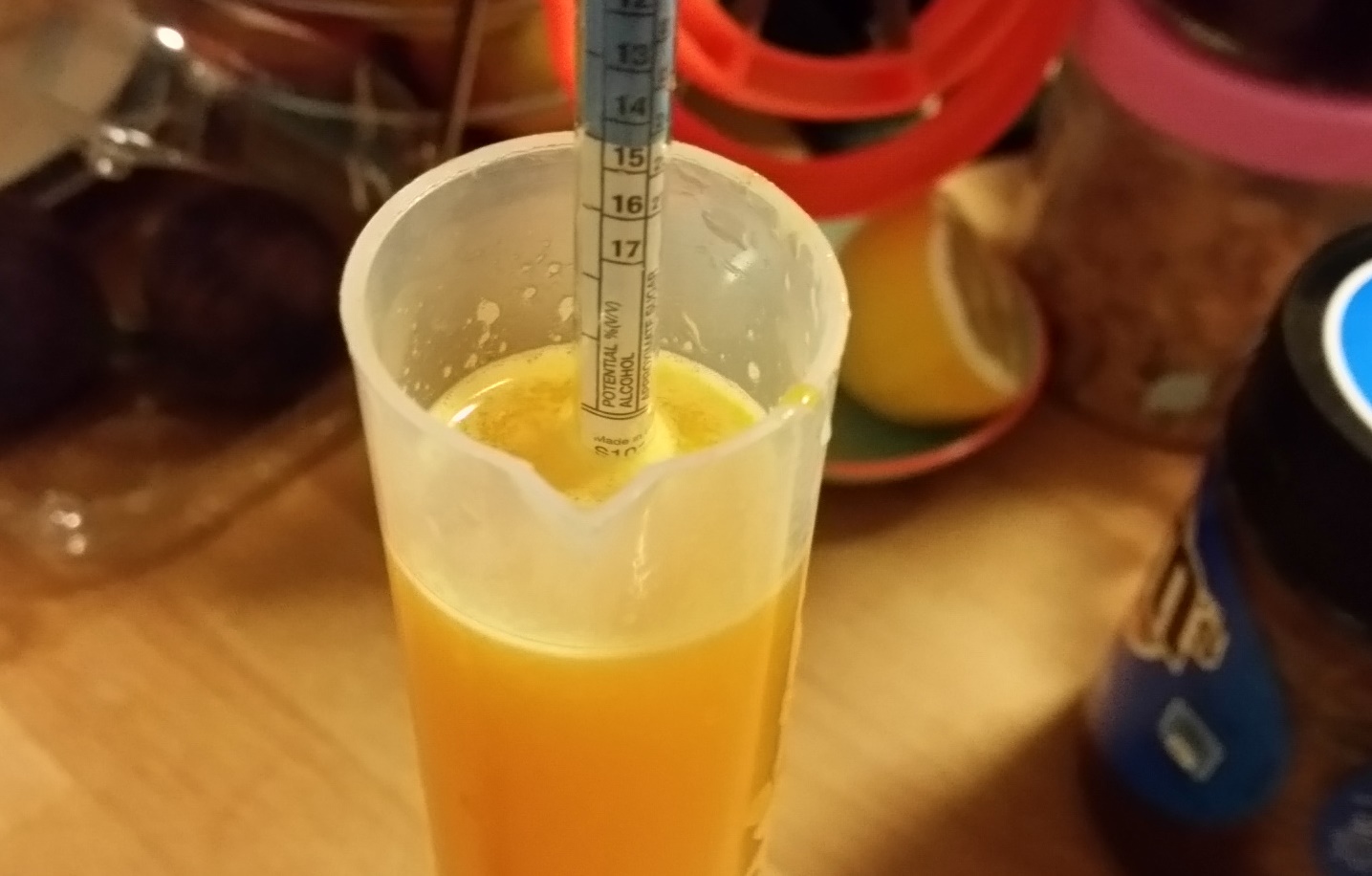 wine hydrometer in mandarin syrup